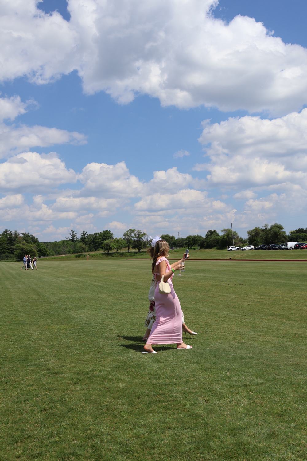 A member crossing the polo field