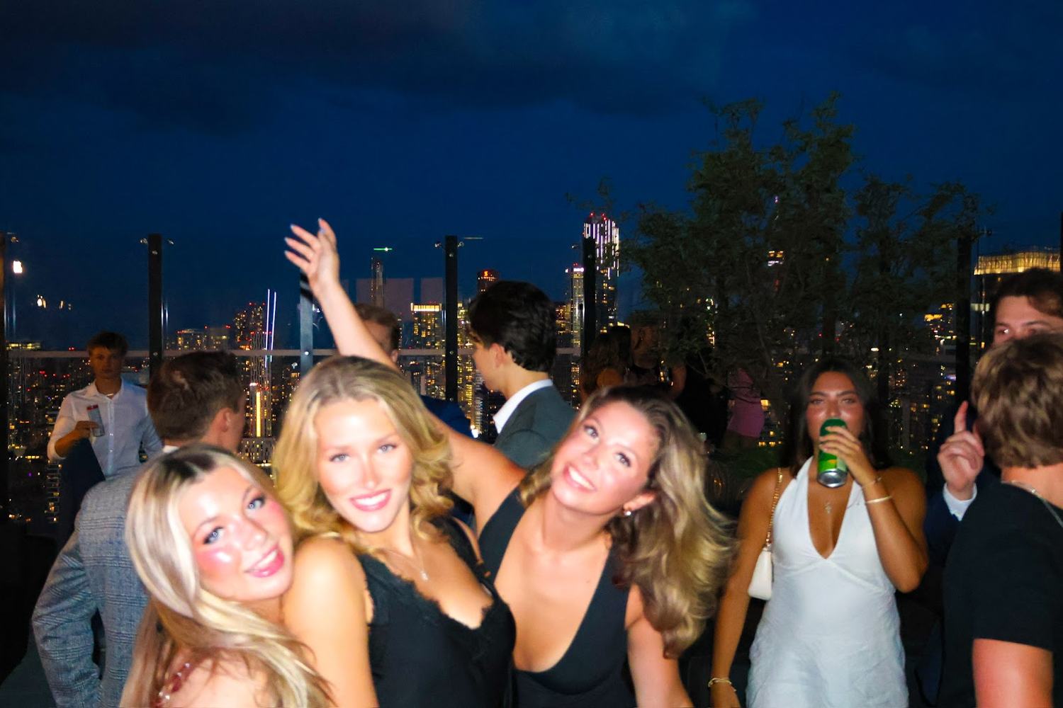 Members on the terrace with the skyline behind