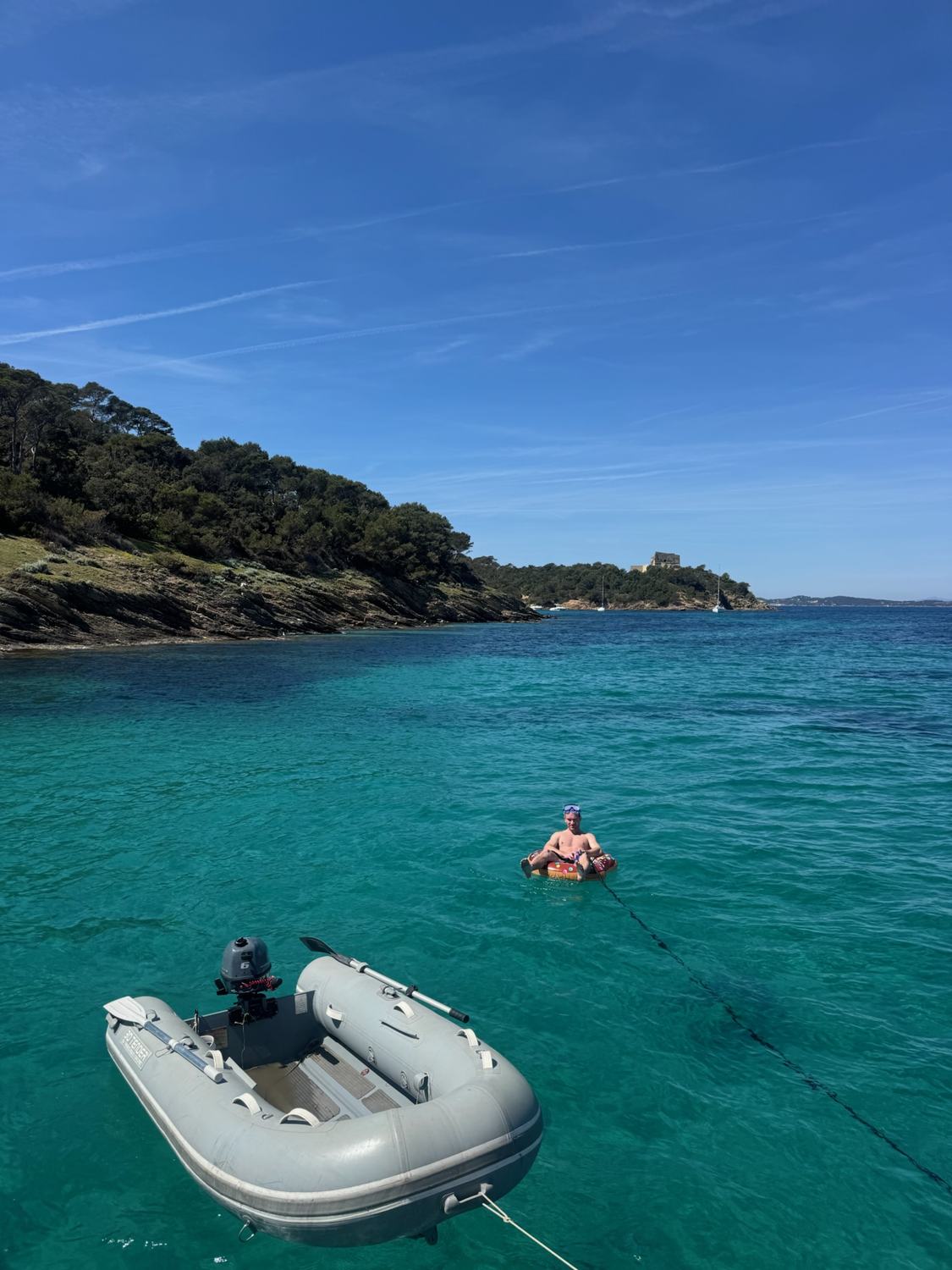 A dinghy on clear turquoise water